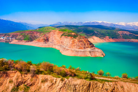 Lake Charvak or Chorvoq is a water reservoir in Chimgan region, Tian Shan or Tengri Tagh mountain range near Taskent city in Uzbekistanの写真素材