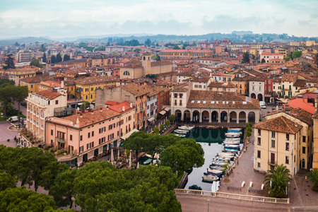 Desenzano del Garda harbor aerial panoramic view. Desenzano is a town on the shore of Lake Garda in the Brescia province in Lombardy, Italy.の写真素材