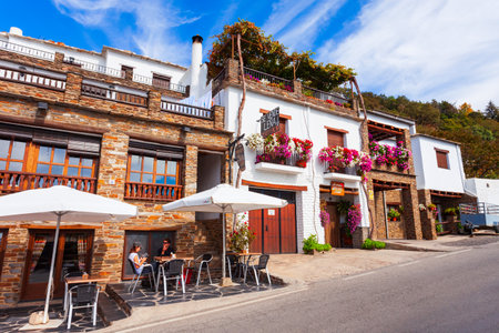 Capileira, Spain - October 21, 2021: Beauty street cafe in Capileira village. Capileira is the highest village in the Alpujarras area in the province of Granada in Andalusia, Spainのeditorial素材