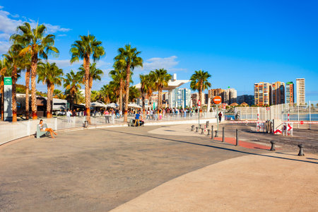 Malaga, Spain - October 23, 2021: Paseo del Muelle Uno boardwalk is a popular pedestrian promenade located in the centre of the city of Malagaのeditorial素材