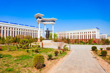 Urgench, Uzbekistan - April 13, 2021: Muhammad ibn Musa al-Khwarizmi monument and Town Hall administration building in Urgench city, Uzbekistanのeditorial素材