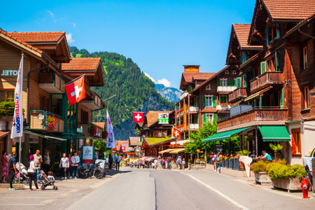 LAUTERBRUNNEN, SWITZERLAND - JULY 14, 2019: Traditional local houses in Lauterbrunnen village in the Interlaken district in the Bern canton of Switzerlandのeditorial素材