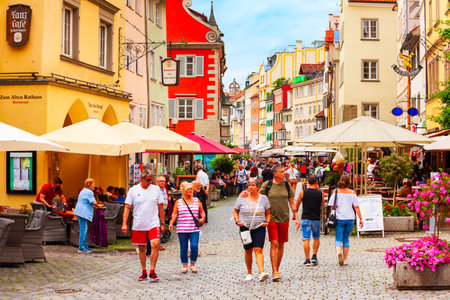 Lindau, Germany - July 04, 2021: Steet cafe in Lindau old town. Lindau is a major town and island on the Lake Constance or Bodensee in Bavaria, Germany.のeditorial素材