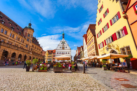 Rothenburg ob der Tauber, Germany - July 11, 2021: Colorful houses at the Market Square or Marktplatz in Rothenburg ob der Tauber old town in the Franconia region of Bavaria, Germany.のeditorial素材