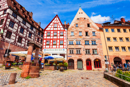 Nuremberg, Germany - July 10, 2021: Tiergartnertorplatz square with colorful fachwerk houses in Nuremberg old town. Nuremberg is the second largest city of Bavaria state in Germany.のeditorial素材