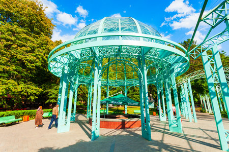 Borjomi, Georgia - September 01, 2021: Glass pavilion above hot spring of mineral water in Borjomi central park. Borjomi is a resort town in Samtskhe Javakheti region of Georgia.のeditorial素材
