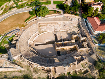 Tarragona Amphitheatre aerial panoramic view. Tarragona Amphitheatre is a Roman amphitheatre in the city of Tarragona in the Catalonia region of Spain.のeditorial素材