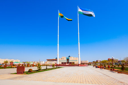 National flag of Uzbekistan and Karakalpakstan region flag near the Nukus Art Museum in the centre of Nukus city in Uzbekistanのeditorial素材