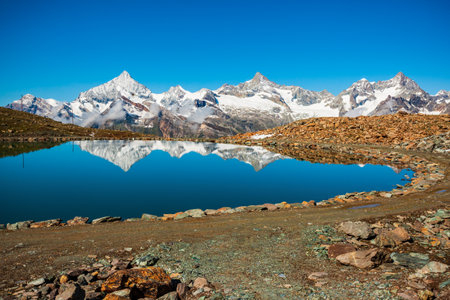 Riffelsee lake and Matterhorn mountain in the Alps, located between Switzerland and Italyの写真素材