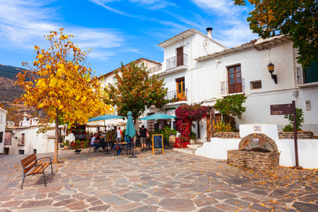 Capileira, Spain - October 21, 2021: Fountain at Plaza Calvario square in Capileira village in the Alpujarras area in the province of Granada in Andalusia, Spain.のeditorial素材