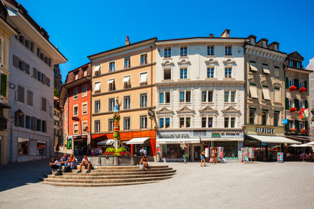 LAUSANNE, SWITZERLAND - JULY 19, 2019: Place de la Palud square with fountain is the oldest square in Lausanne city, which located on Lake Geneva shores in Switzerlandのeditorial素材