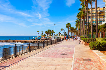 Marbella, Spain - October 24, 2021: Marbella beach promenade. Marbella is a city in the province of Malaga in the Andalusia, Spain.のeditorial素材