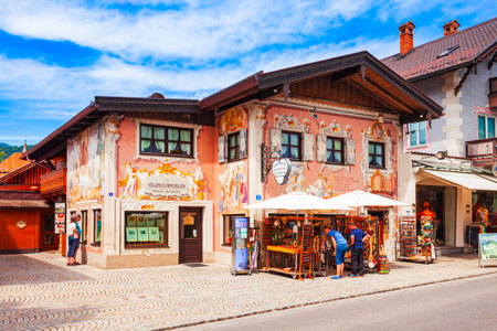 Oberammergau, Germany - July 03, 2021: Beauty houses with luftlmalerei bayern art form of house facade painting in Oberammergau town in Bavaria, Germanyのeditorial素材