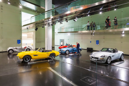 Munich, Germany - July 08, 2021: Row of classic to modern BMW car series on display in BMW Museum, an automobile museum of BMW history located near the Olympiapark in Munich, Germanyのeditorial素材