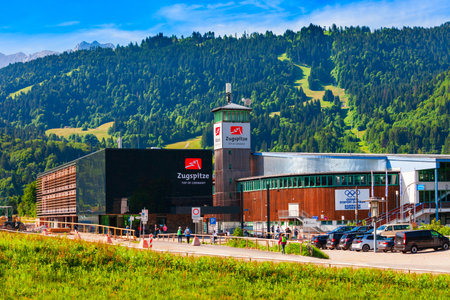 Garmisch-Partenkirchen, Germany - July 03, 2021: Garmisch Olympia Stadium and Zugspitze railway station or Zugspitzbahn building in Garmisch Partenkirchen town in Bavaria, southern Germanyのeditorial素材