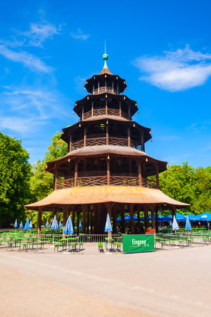 Munich, Germany - July 06, 2021: Chinese Tower or Chinesischer Turm is a 25 metre high wooden tower in the English Garden or Englischer Garten, a public park in the centre of Munich, Bavariaのeditorial素材