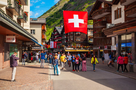 ZERMATT, SWITZERLAND - JULY 15, 2019: Traditional local houses in the centre of Zermatt town in the Valais canton of Switzerlandのeditorial素材