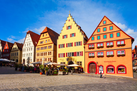 Rothenburg ob der Tauber, Germany - July 11, 2021: Colorful houses at the Market Square or Marktplatz in Rothenburg ob der Tauber old town in the Franconia region of Bavaria, Germany.のeditorial素材