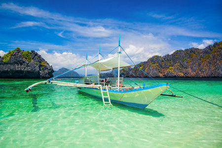 Traditional filipino boat bangka or banca in El Nido province, Palawan island in Philippinesの写真素材