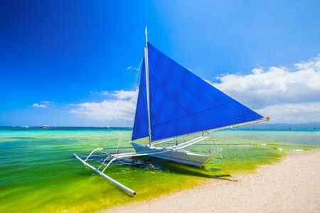 Traditional filipino boat at the idyllic white sand beach at Boracay island in Philiphinesの写真素材