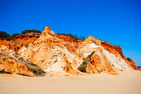 Falesia beach with beauty limestone cliff in Albufeira city, Algarve region in Portugalの写真素材