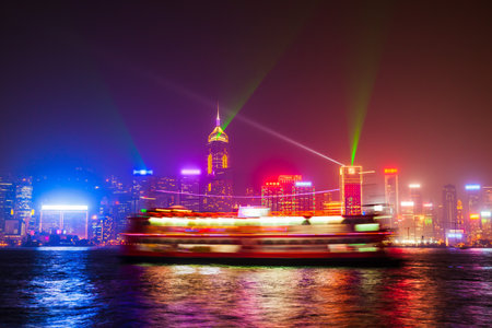 Hong Kong Island skyline with light show viewed from the Victoria Harbour waterfront. Hong Kong is a city and special region of China.の写真素材