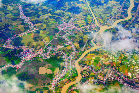 Manila suburb with small houses and rice fields aerial panoramic view from the plane, Philippinesの写真素材