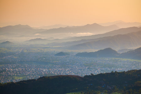 Himalaya hills aerial panoramic view from Sarangkot hill viewpoint in Pokhara city in Nepal at sunriseの写真素材