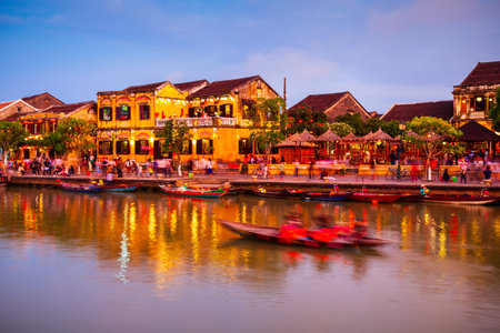 Fishing boats at the riverfront of Hoi An ancient town in Quang Nam Province of Vietnamの写真素材