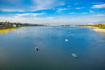 Boats on Angara river in the center of Irkutsk, Russiaの写真素材