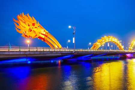 Danang Dragon bridge through Han river in Da Nang city in Vietnamの写真素材