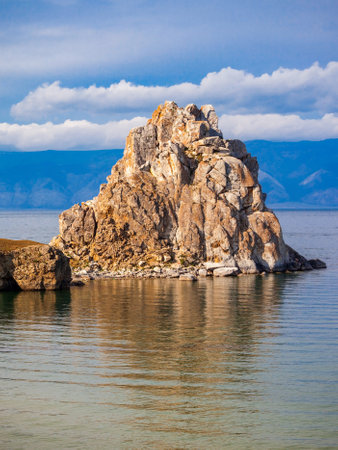 Shamanka or Shamans Rock on Baikal lake near Khuzhir at Olkhon island in Siberia, Russia. Lake Baikal is the largest freshwater lake in the world.の写真素材