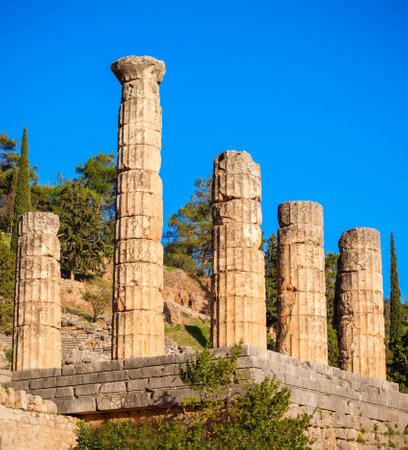 Ruined columns of the Temple of Apollo in Delphi. Delphi was an important ancient Greek religious sanctuary sacred to the god Apollo.の写真素材