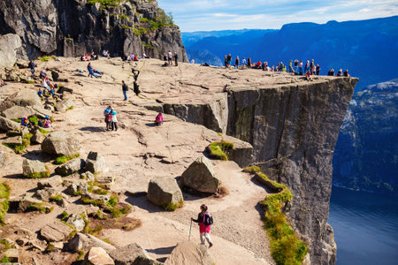 Preikestolen or Prekestolen or Pulpit Rock is a famous tourist attraction near Stavanger, Norway. Preikestolen is a steep cliff which rises above the Lysefjord.の写真素材