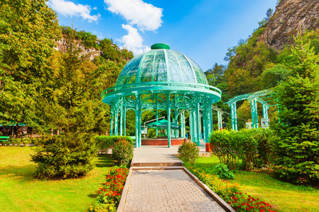 Borjomi, Georgia - September 01, 2021: Glass pavilion above hot spring of mineral water in Borjomi central park. Borjomi is a resort town in Samtskhe Javakheti region of Georgia.のeditorial素材