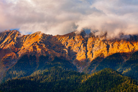 Caucasus mountains around Lake Ritsa in Abkhazia region in Georgia at sunsetの写真素材