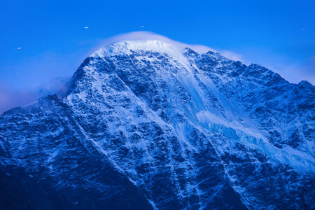 Close-up of Donguzorun or Donguz Orun or Babis Mta mountain in Mount Elbrus region in Caucasus, Russia at nightの写真素材