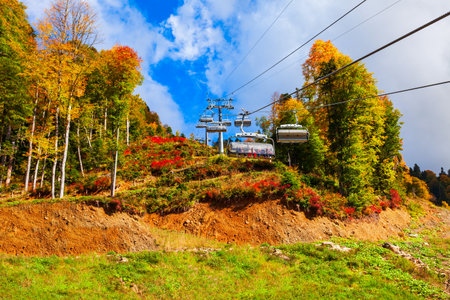 Cable car cabin rises up from Rosa Khutor village to Roza Peak mountain in Sochi resort city in Krasnodar Krai, Russiaの写真素材