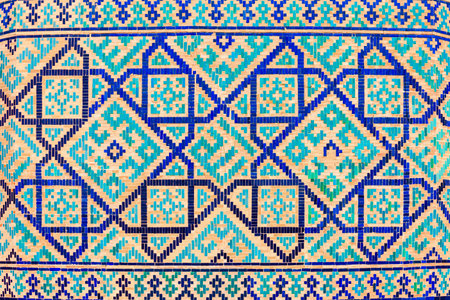 Registan mosaic pattern design background of ceramic tiles of Registan madrasah in Samarkand city, Uzbekistanの写真素材