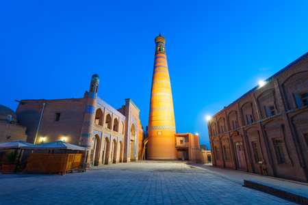 Islam Khodja Minaret at the Itchan Kala, the walled inner town of the city of Khiva in Uzbekistan at sunsetの写真素材