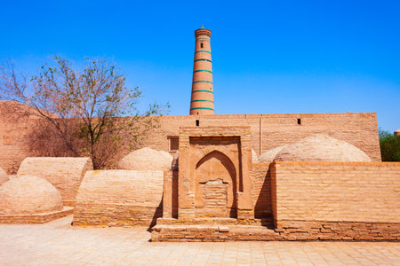 Juma Masjid and Minaret at the Ichan Kala, an ancient walled inner town of the city of Khiva in Uzbekistanの写真素材