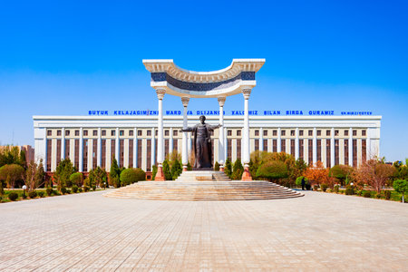 Urgench, Uzbekistan - April 13, 2021: Muhammad ibn Musa al-Khwarizmi monument and Town Hall administration building in Urgench city, Uzbekistanのeditorial素材
