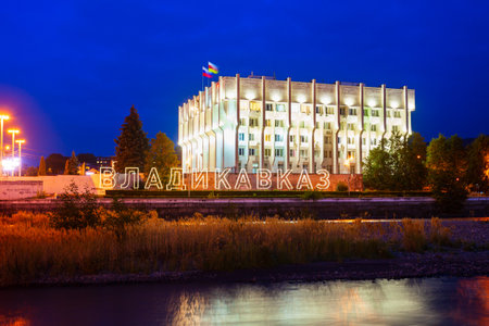 Vladikavkaz, Russia - September 25, 2020: City administration building at the Terek river embankment in Vladikavkaz city, North Ossetia Alania, Russia at nightのeditorial素材