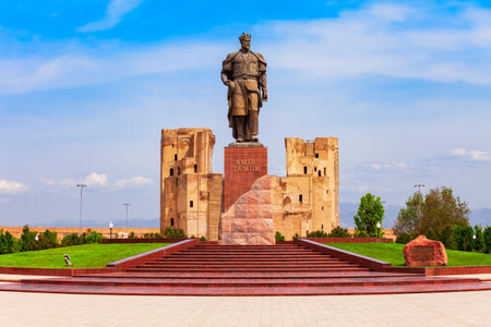 Shahrisabz, Uzbekistan - April 19, 2021: Tamerlane or Amir Timur monument and Ak-Saray or Ak Saray palace in the city of Shahrisabz in Uzbekistanのeditorial素材
