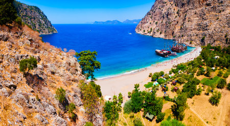 Butterfly Valley Beach or Kelebekler Vadisi aerial panoramic view. Butterfly Beach is a beautiful beach near Oludeniz village, district of Fethiye in Turkey.の写真素材