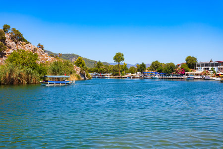 Boats at Dalyan river in Dalyan town in Mugla Province, Turkeyの写真素材