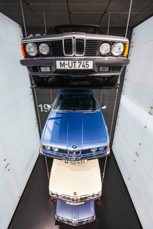 Munich, Germany - July 08, 2021: Row of classic to modern BMW car series on display in BMW Museum, an automobile museum of BMW history located near the Olympiapark in Munich, Germanyのeditorial素材