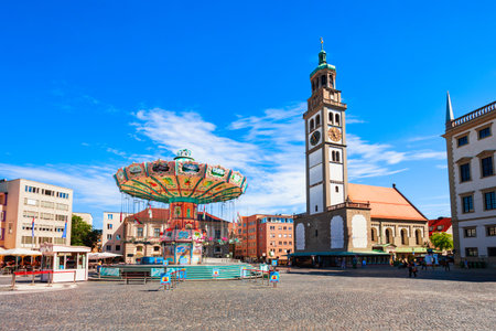 Augsburg, Germany - July 06, 2021: Chain carousel and Perlachturm Tower, a belltower in front of the church of St. Peter am Perlach. Augsburg is a city in Swabia, Bavaria region of Germany.のeditorial素材