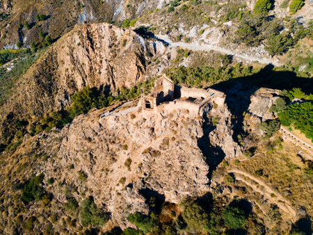 Lanjaron Castle or Castillo de los Moros aerial panoramic view, it is a small medieval fortress in Lanjaron town in the Alpujarras area in the province of Granada in Andalusia, Spainの写真素材