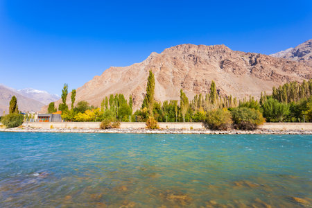 Ghunt river in Khorog city and Pamir mountains. Khorog is situated along the Pamir Highway in Gorno-Badakhshan, Tajikistan.の写真素材